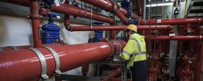 Hand reaching to turn on faucet following exceptional service from Mr Perfect Plumbing