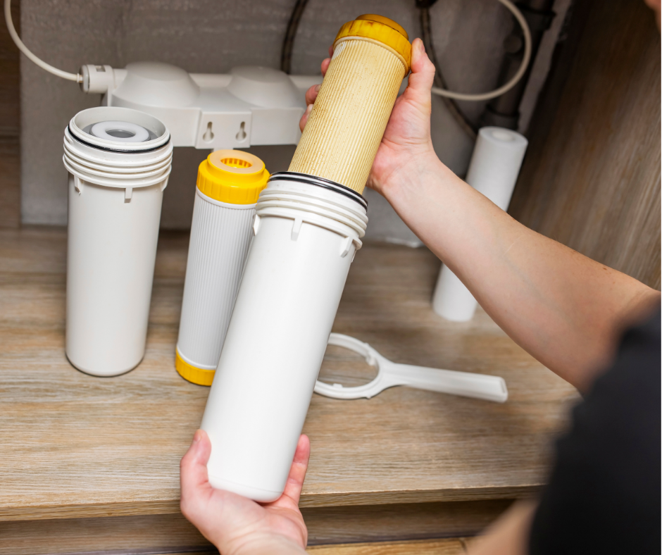 Faucet-mounted water filter in a modern kitchen.